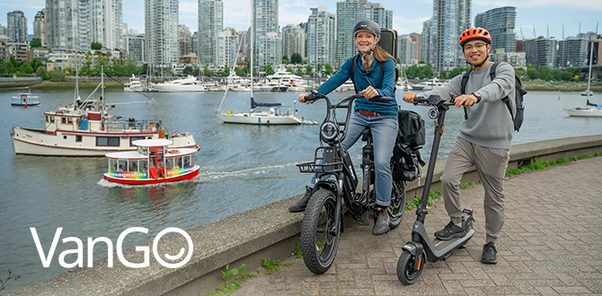 VanGo - people standing with their bikes at the seawall VanGo - people standing with their bikes at the seawall