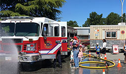 Families standing near a firetruck